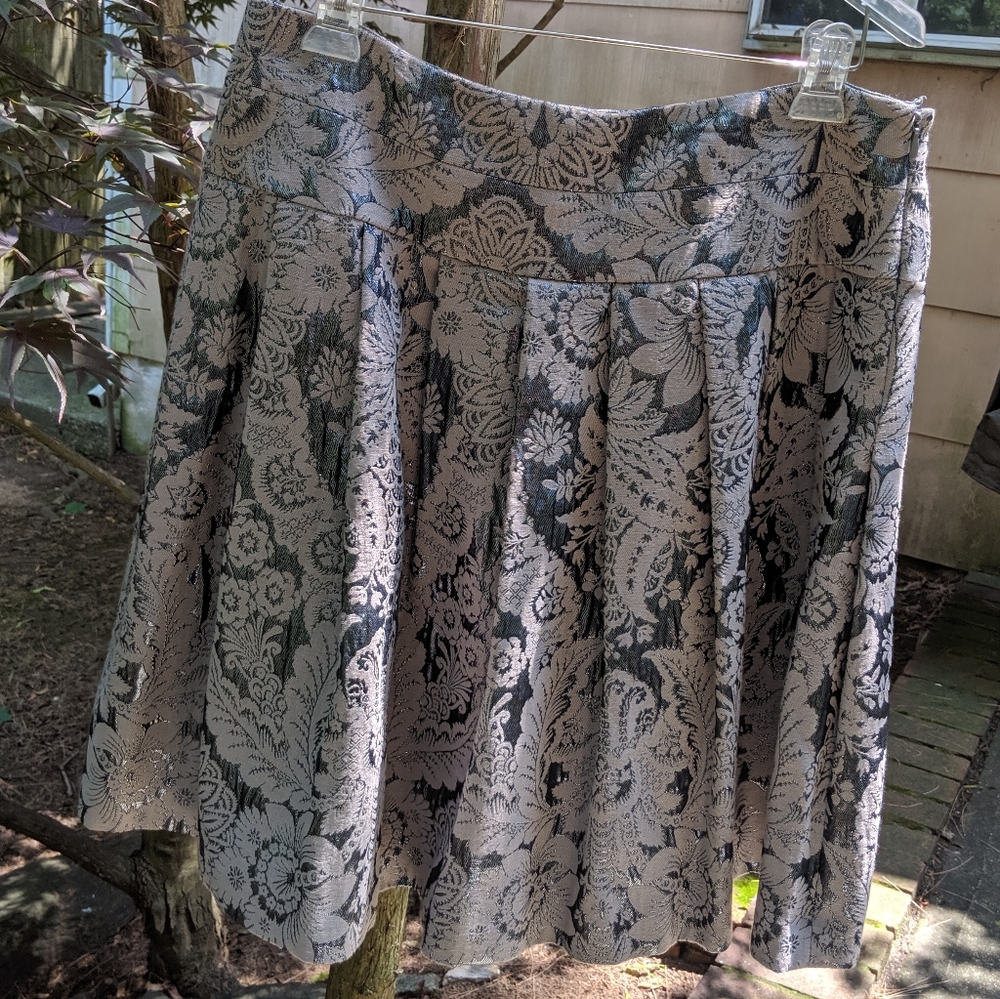 Pleated metallic silver and gray knee length skirt